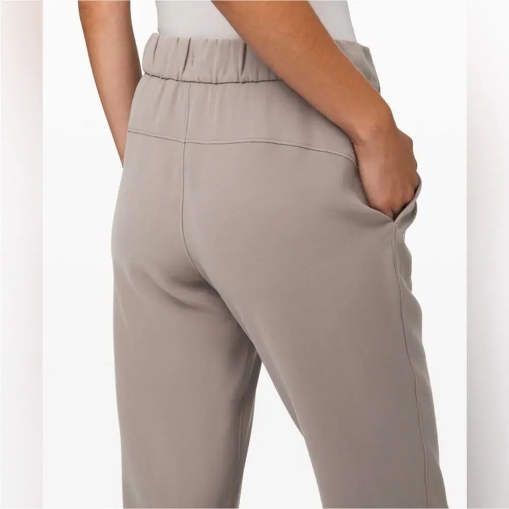 Lululemon On the Fly 7/8 Pants Woven Carbon Dust Tan Grey 8